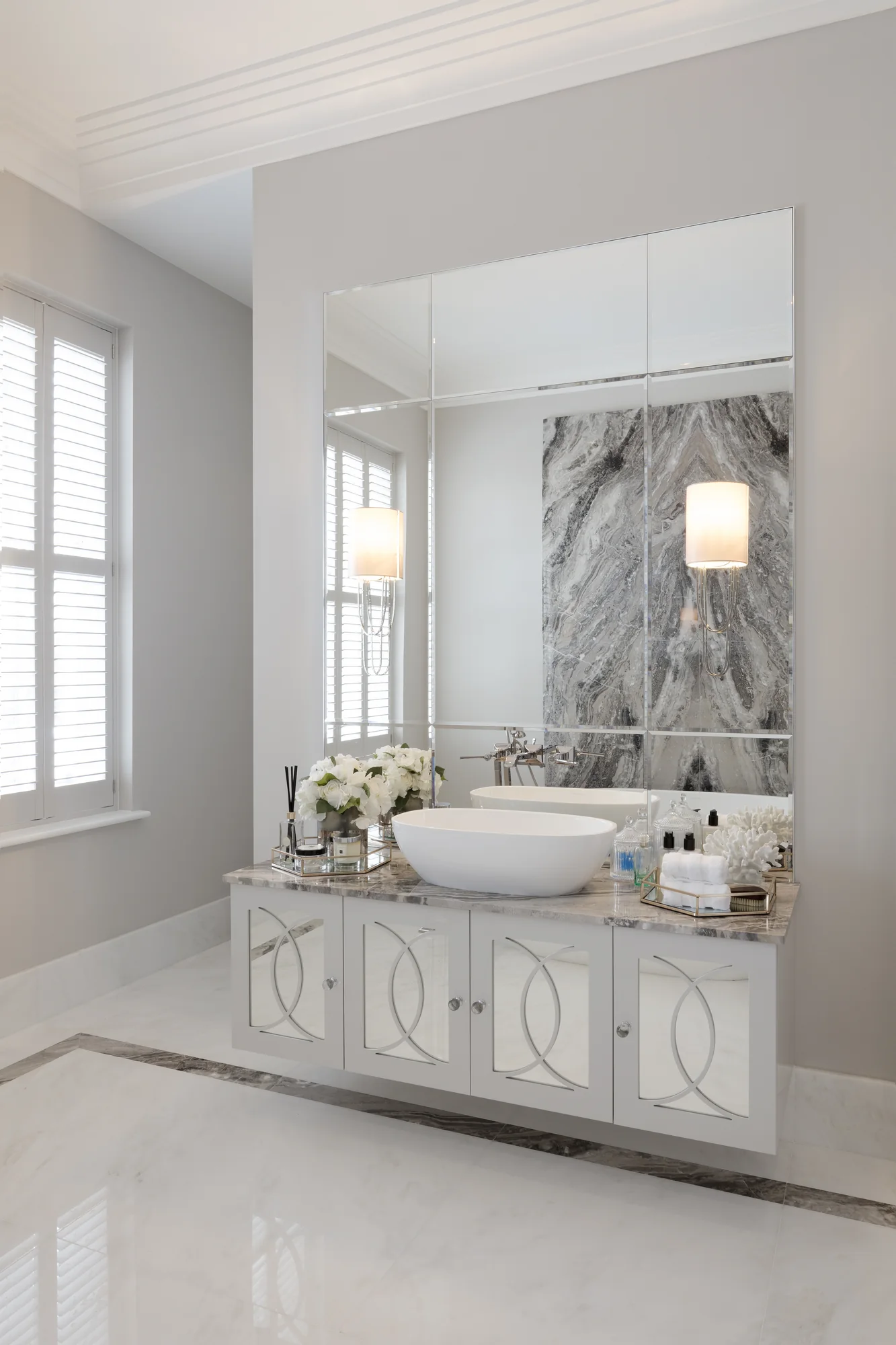 Full view of the vanity, bowl basin and large segmented mirror