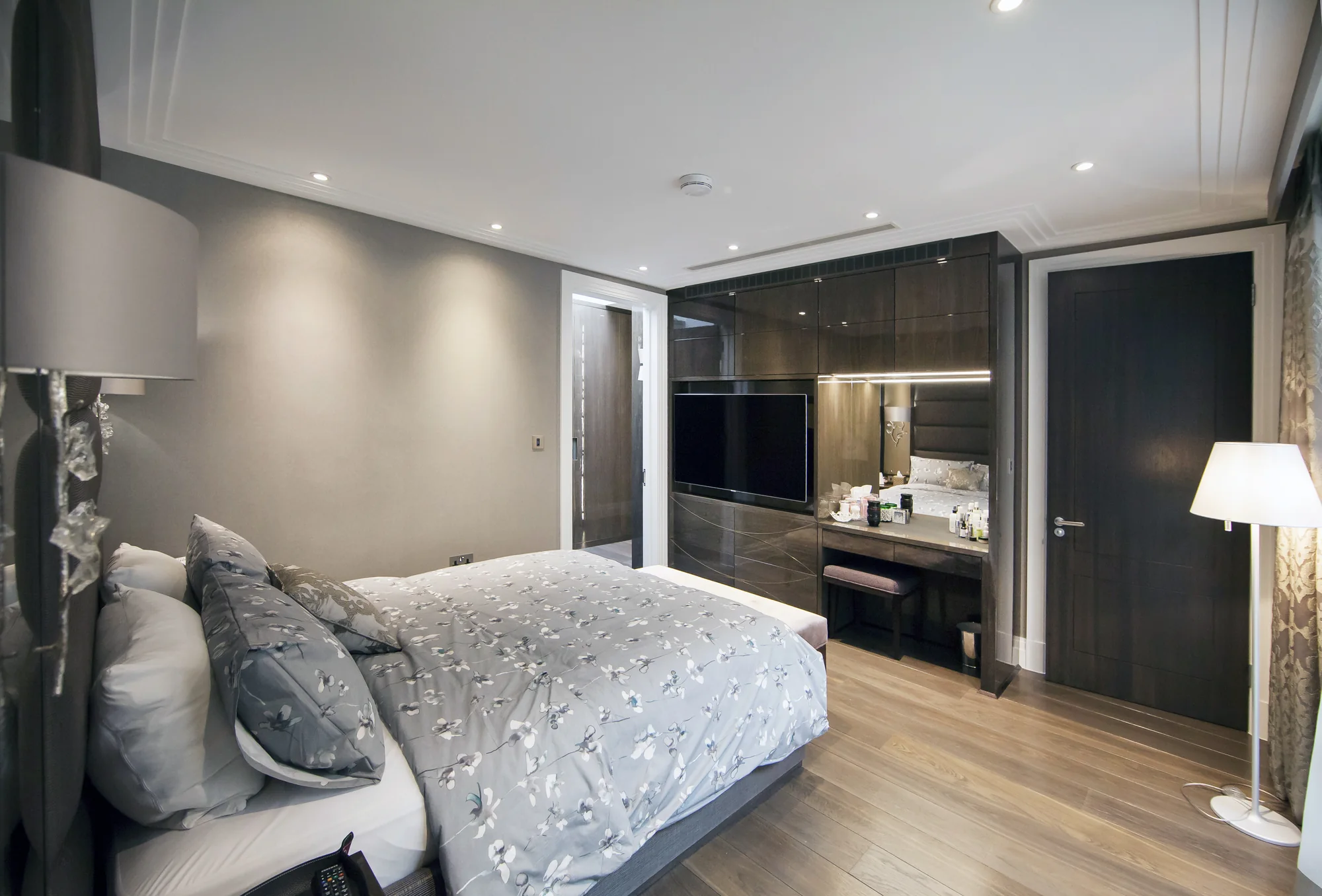Bedroom view towards the fitted TV wall and dressing area