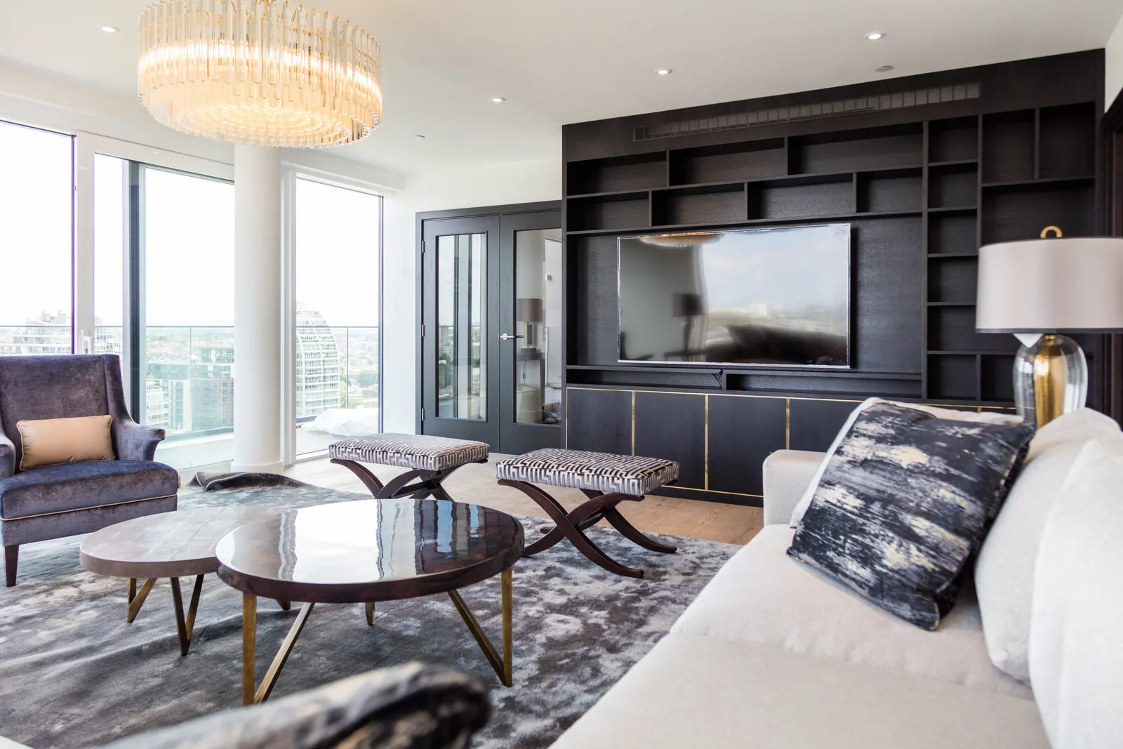 Black oak media wall shown within a bright London interior