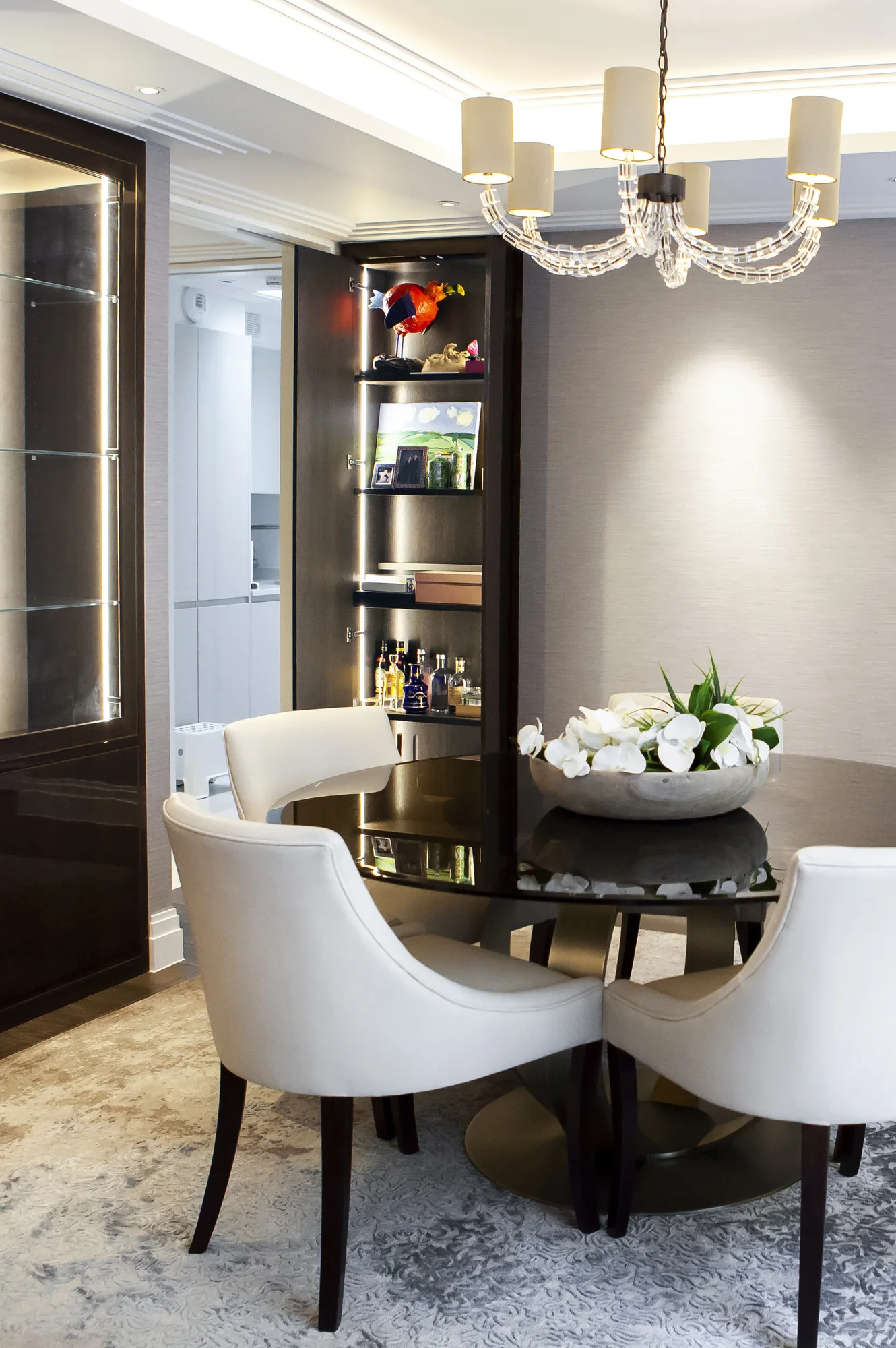 Open tall dining cupboard revealing shelves and stored items