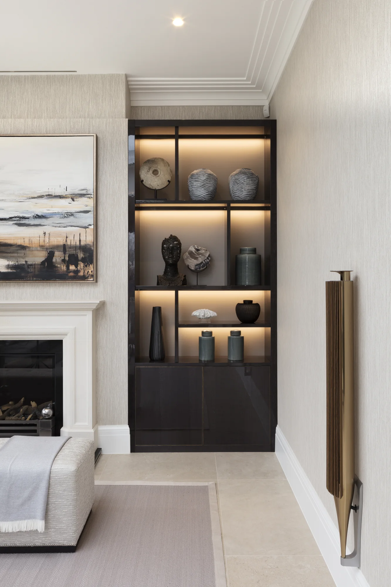 Right-hand alcove with illuminated shelves and lower cupboards