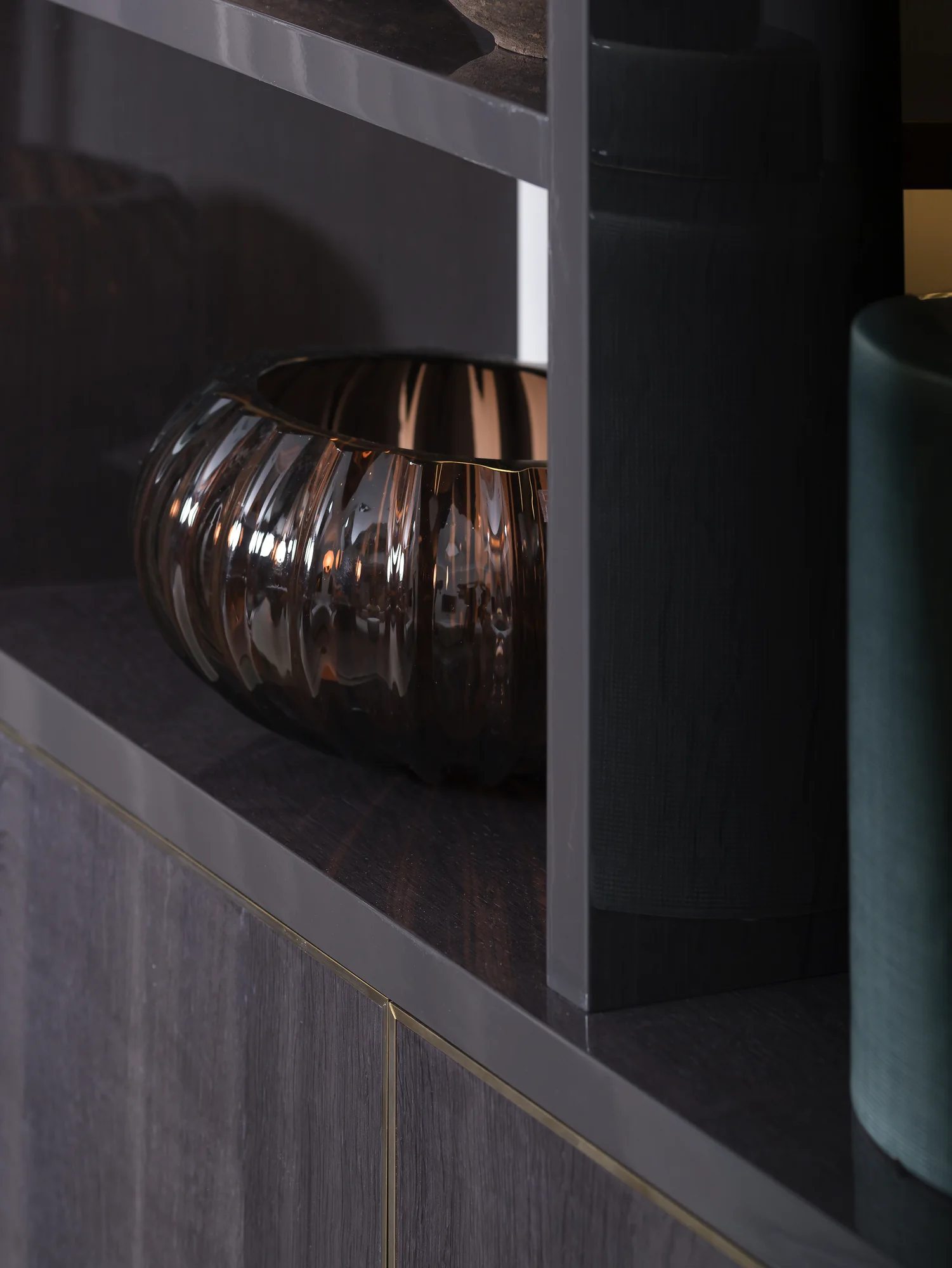 Dark alcove shelf, cabinet edge and decorative bowl detail