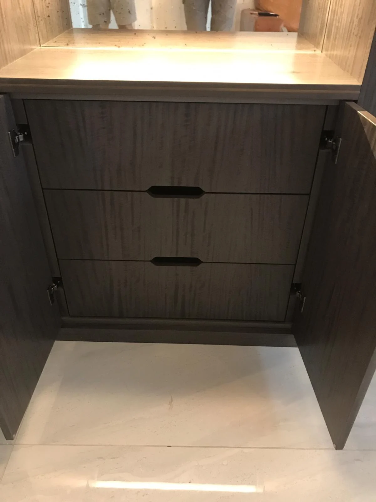 Open lower cupboard revealing two internal wood-grain drawers.